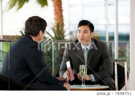 Businessmen with airline tickets and passports 7898751