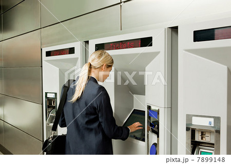 Businesswoman buying a train ticket 7899148
