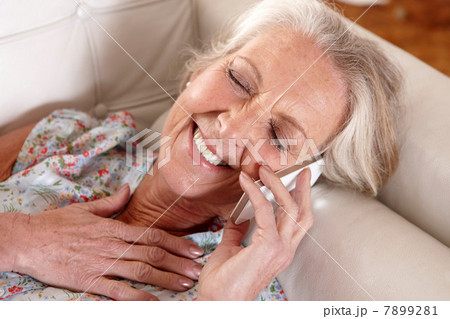 Older woman talking on cell phone 7899281