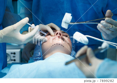 Young woman having facial plastic surgery Young woman having facial plastic surgery 7899282