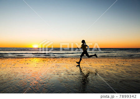 Woman running on beach Woman running on beach 7899342