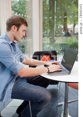 University student working on laptop 7899343