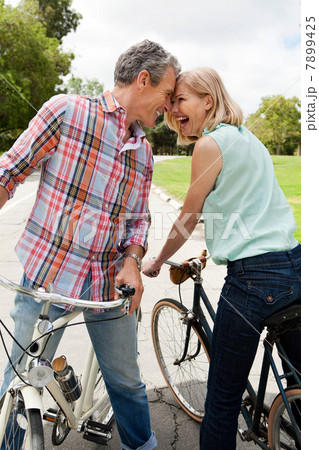 Mature couple on bicycles Mature couple on bicycles 7899425