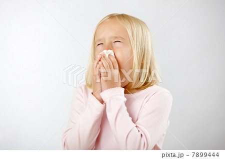 Girl with cold blowing nose Girl with cold blowing nose 7899444