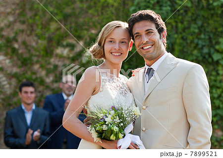 Newlyweds at marriage ceremony, looking away Newlyweds at marriage ceremony, looking away 7899521