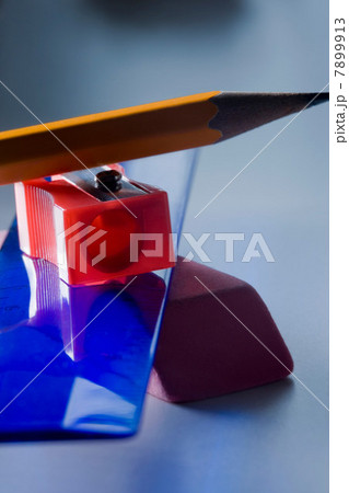 Eraser, ruler, pencil sharpener and pencil in a pile Eraser, ruler, pencil sharpener and pencil in a pile 7899913