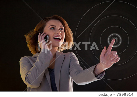 Young woman on cellphone and touching virtual circle 7899914