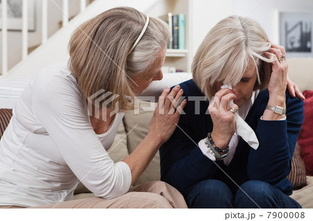 Senior woman comforting crying friend Senior woman comforting crying friend 7900008