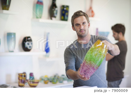 Man holding glass vase Man holding glass vase 7900009