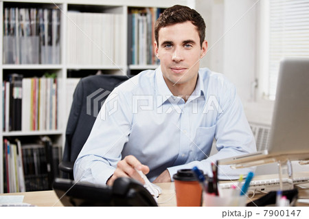Office worker at his desk Office worker at his desk 7900147