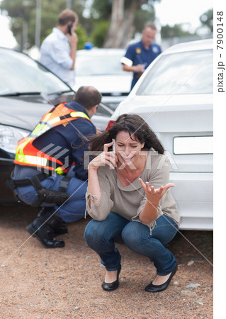 Woman crying after car accident 7900148
