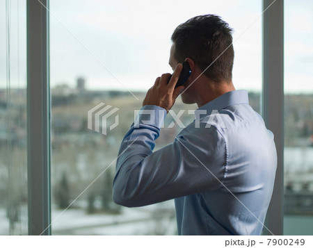 Businessman talking on cell phone Businessman talking on cell phone 7900249