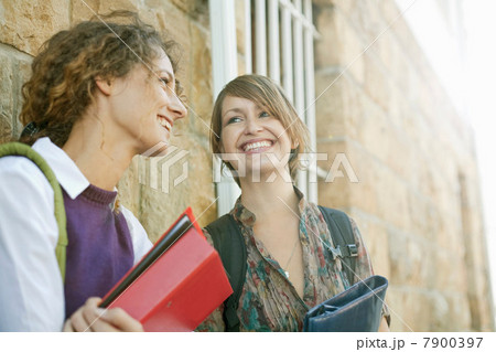 Students talking outside building 7900397