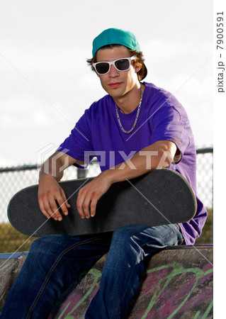 Young man with skateboard Young man with skateboard 7900591