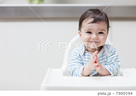 Happy baby in high chair 7900594