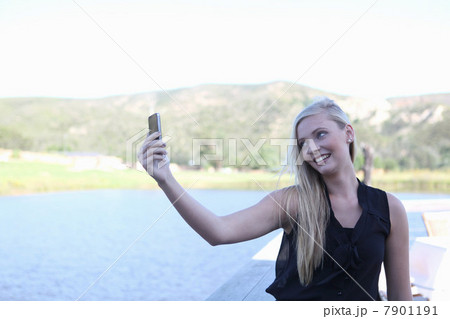 Woman taking picture of herself 7901191