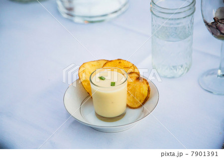 Plate of soup with potato chips 7901391