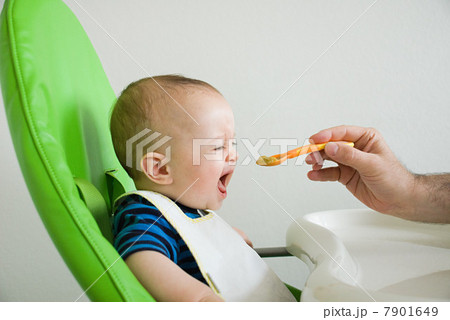 Baby being fed 7901649