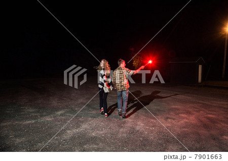 Couple holding sparkler Couple holding sparkler 7901663