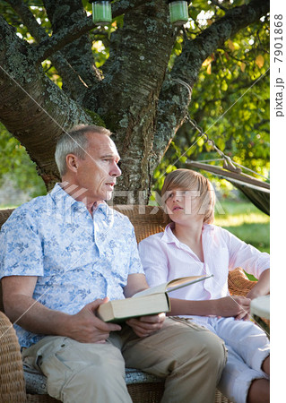 Father and son with book, in conversation Father and son with book, in conversation 7901868