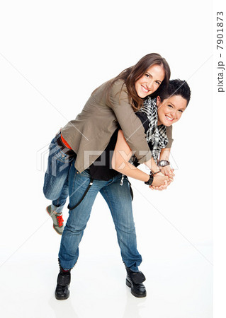 Lesbian couple standing against white background Lesbian couple standing against white background 7901873