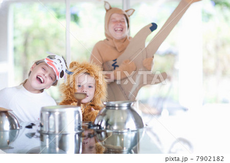 Children pretending to play music instruments 7902182