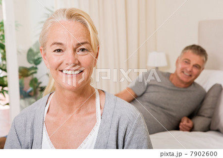 Mature couple in bedroom 7902600