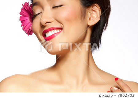 Young woman with closed eyes against white background Young woman with closed eyes against white background 7902702
