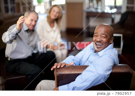 Older man smiling in armchair Older man smiling in armchair 7902957