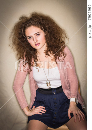 Woman sitting in corner Woman sitting in corner 7902969