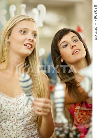 Woman shopping together in store Woman shopping together in store 7903039