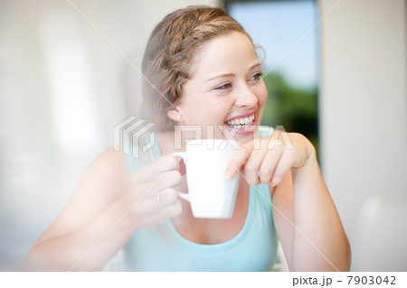 Young woman holding mug Young woman holding mug 7903042