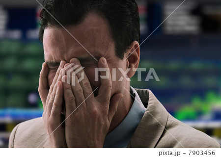 Businessman crying at stock exchange 7903456