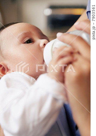 Baby girl drinking bottle of milk Baby girl drinking bottle of milk 7903561