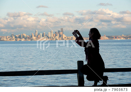 Woman taking picture of Seattle skyline Woman taking picture of Seattle skyline 7903673