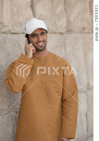 Middle Eastern man using mobile phone Middle Eastern man using mobile phone 7903921