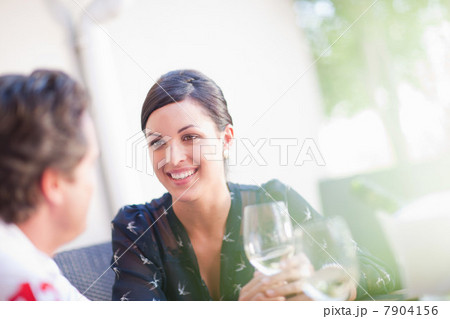 Couple having drinks together outdoors Couple having drinks together outdoors 7904156