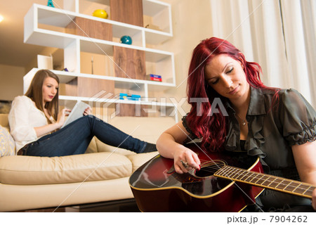 Women relaxing in living room 7904262