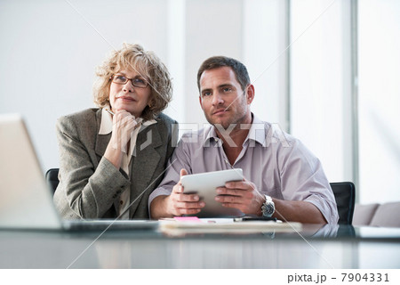 Business people listening in meeting Business people listening in meeting 7904331