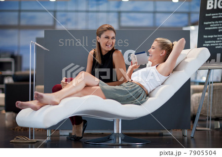 Women shopping for furniture in store 7905504