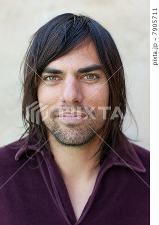 Portrait of mid adult man in purple shirt 7905711