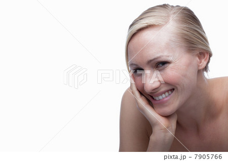 Young woman with hand on chin Young woman with hand on chin 7905766