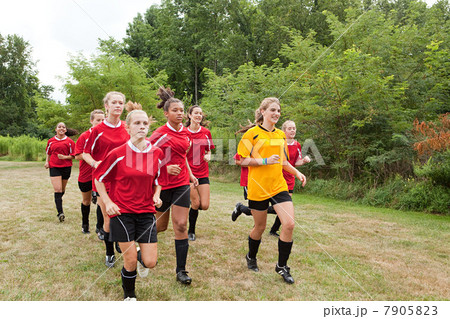 Girl soccer players running 7905823
