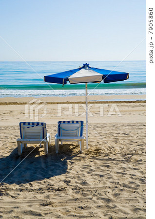 Sunlounger and parasol on beach, Benidorm, Costa Blanca, Spain 7905860