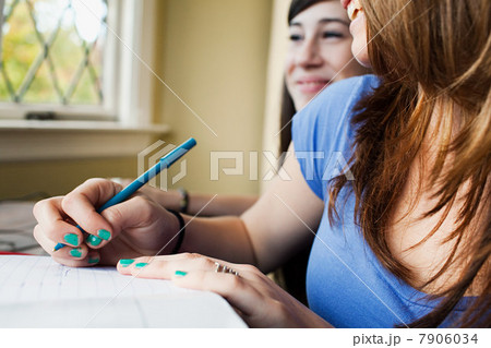 Teenage girls doing homework Teenage girls doing homework 7906034
