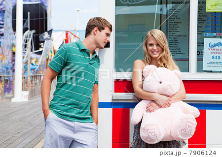 Teenage couple at pier with teddy bear Teenage couple at pier with teddy bear 7906124