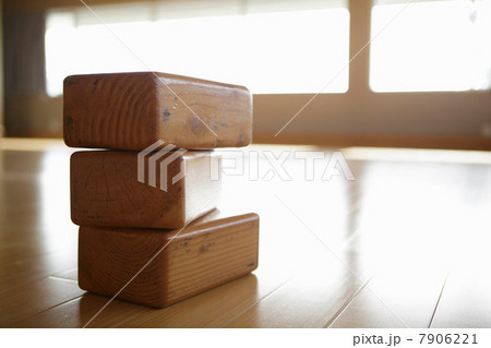 Pile of wooden yoga bricks in exercise studio 7906221