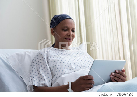 Female hospital patient using digital tablet 7906430