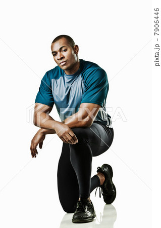 Portrait of athlete kneeling 7906446