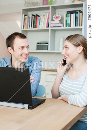Young couple using laptop Young couple using laptop 7906476